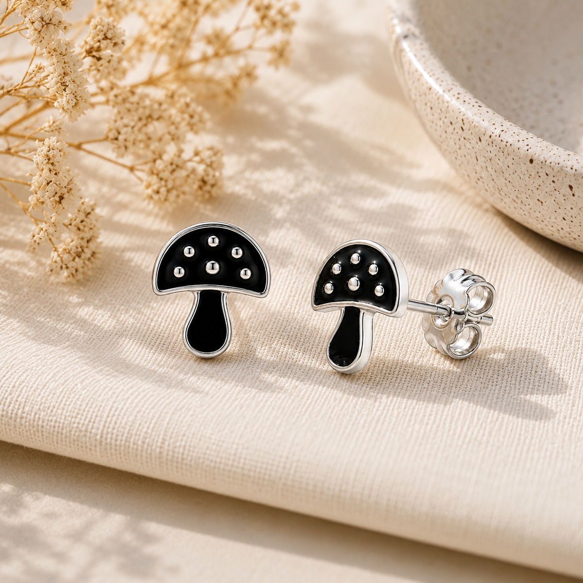 Black Mushroom Stud Earrings with Silver Detailing