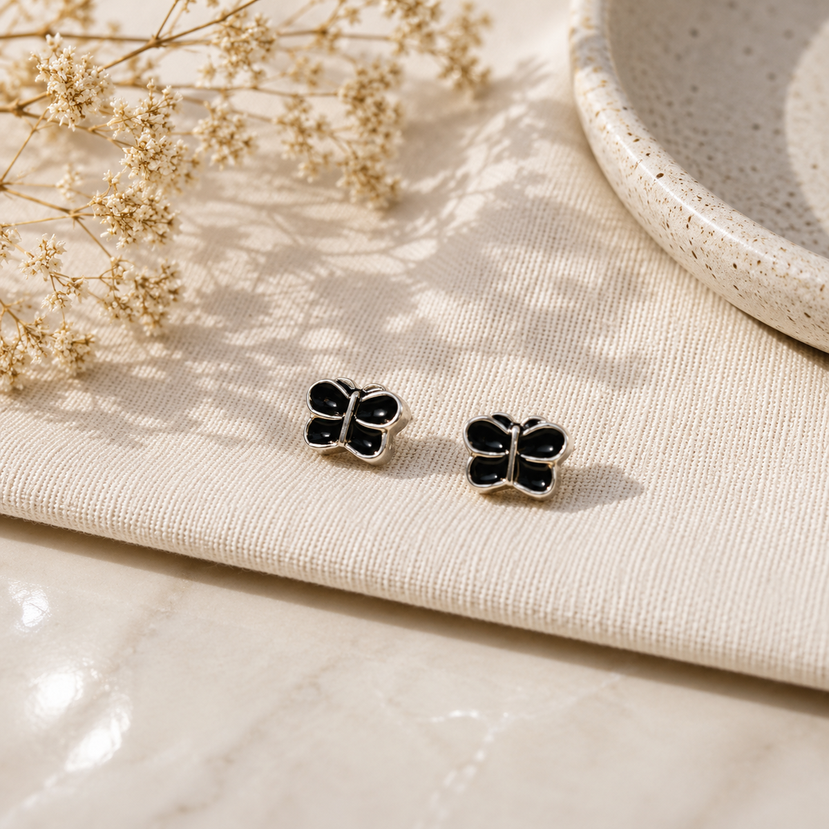 Black Butterfly Stud Earrings with Silver Detailing