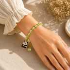 Green Beaded Bracelet with Teddy Bear Charm