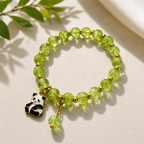 Green Beaded Bracelet with Teddy Bear Charm